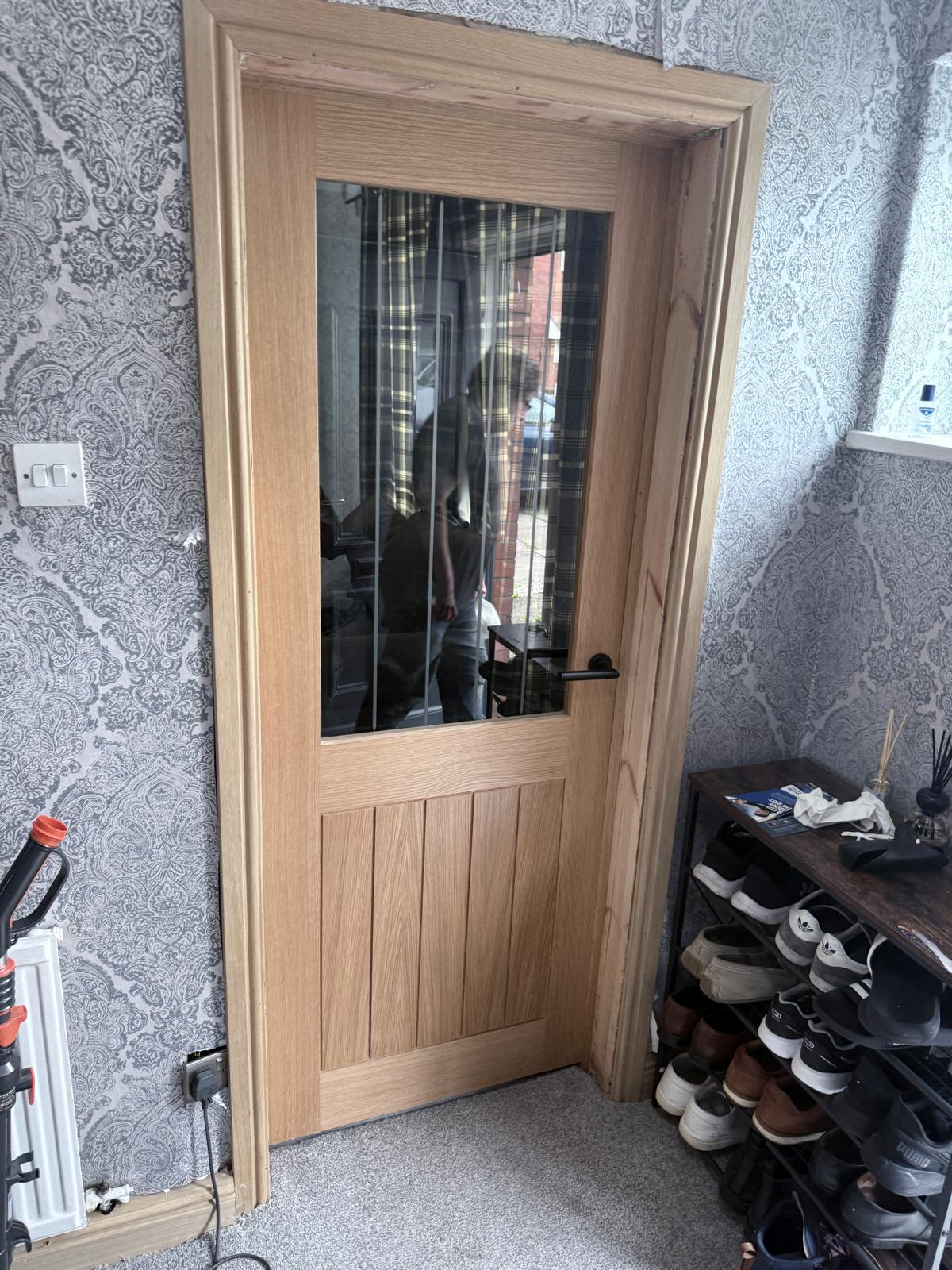 Glazed oak internal door fitted in Salford